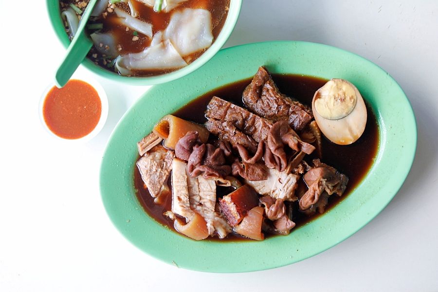 Thick rice sheets as noodles, and assortment of pig offal