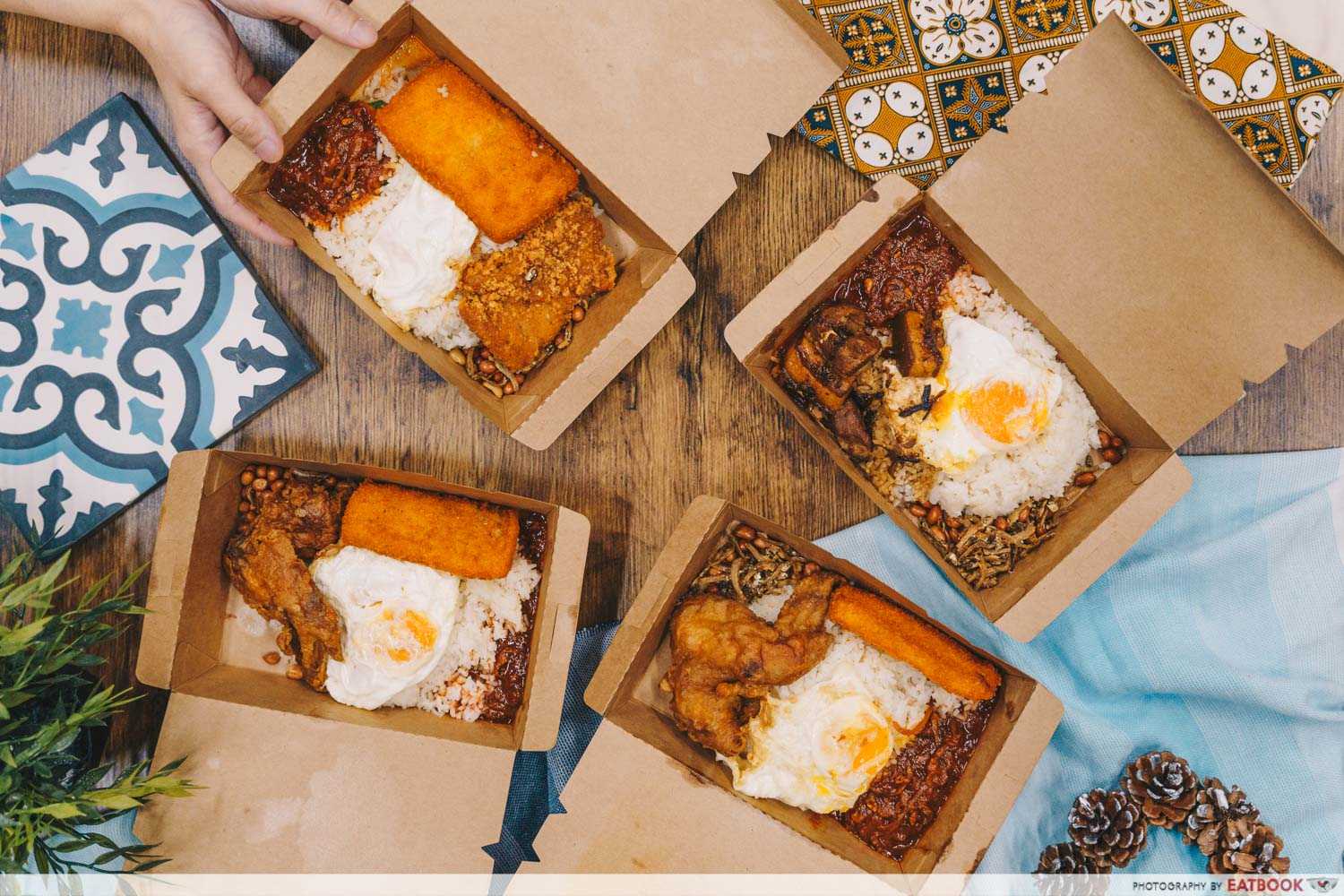 4 types of nasi lemak, which is made of coconut rice,
                fried chicken, fried fish fillet, eggs, peanuts, and sambal.
