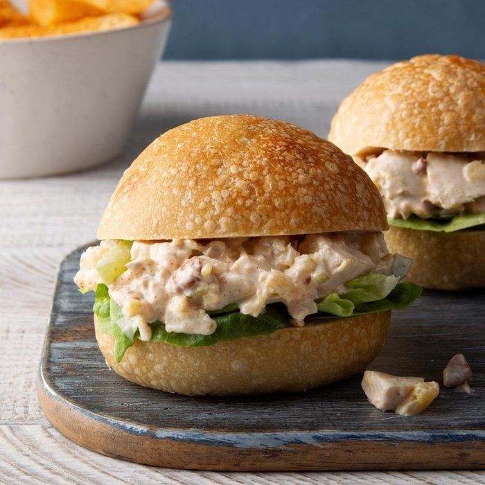 Burger looking bun with lettuce and creamy pineapple chicken
