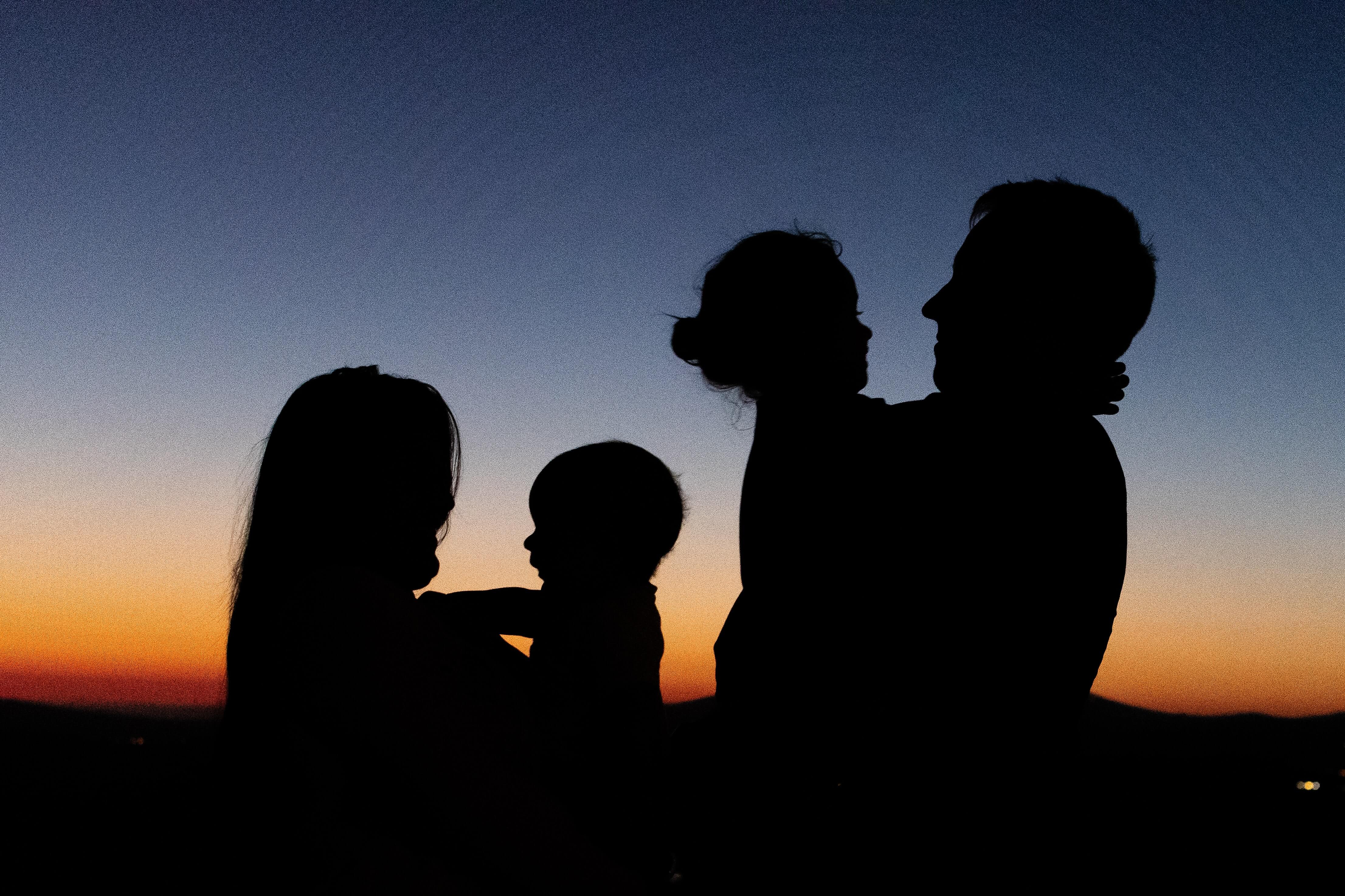 Sunset view with a family's silhouette